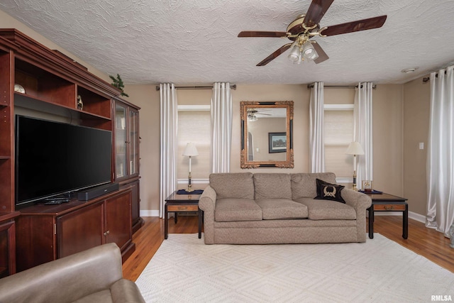 13524 US Route 67, Milan, IL 61264 - living area featuring ceiling fan, light wood-style floors, and a textured ceiling