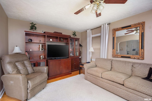 13524 US Route 67, Milan, IL 61264 - living area featuring a ceiling fan and light wood-type flooring
