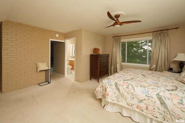 13524 US Route 67, Milan, IL 61264 - bedroom with brick wall, light carpet, ensuite bathroom, and ceiling fan