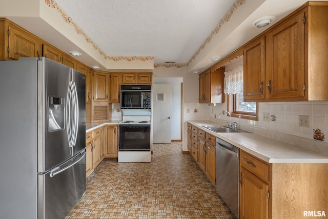20425 20th Ave, Stockton, IA 52769 - kitchen featuring stainless steel appliances, light countertops, backsplash, brown cabinets, and a textured ceiling