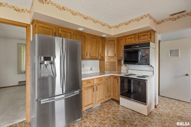 20425 20th Ave, Stockton, IA 52769 - kitchen featuring stainless steel fridge with ice dispenser, white electric range, black microwave, light countertops, and a baseboard radiator
