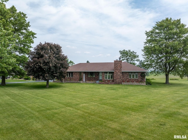20425 20th Ave, Stockton, IA 52769 - ranch-style house featuring a chimney and a front yard