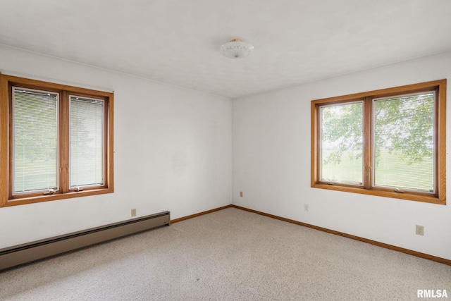 20425 20th Ave, Stockton, IA 52769 - empty room featuring a baseboard heating unit and light carpet