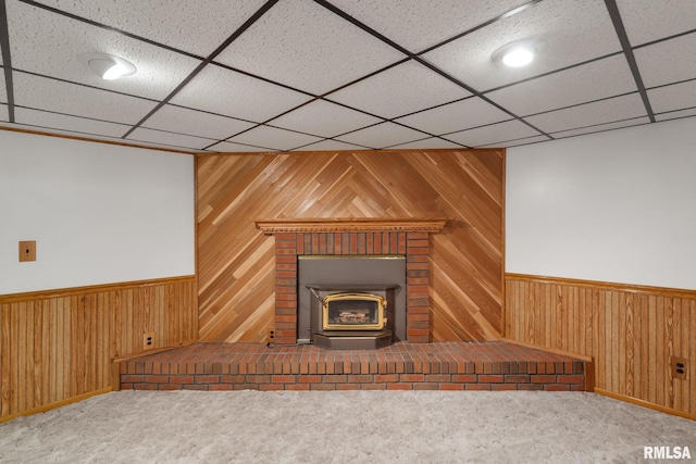 20425 20th Ave, Stockton, IA 52769 - detailed view of wooden walls, a wainscoted wall, carpet floors, and a paneled ceiling