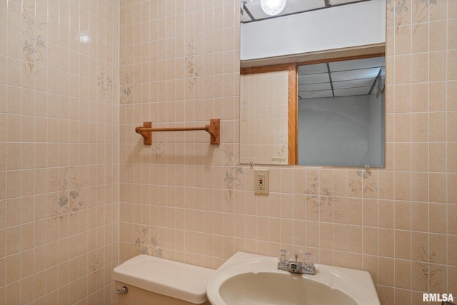 20425 20th Ave, Stockton, IA 52769 - bathroom with tile walls and a sink