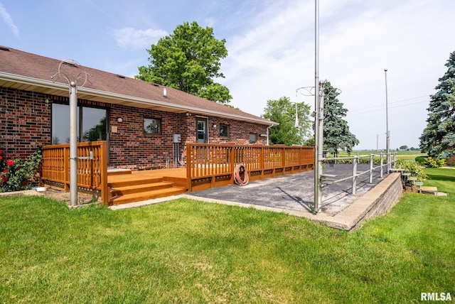 20425 20th Ave, Stockton, IA 52769 - wooden deck featuring a patio area and a yard