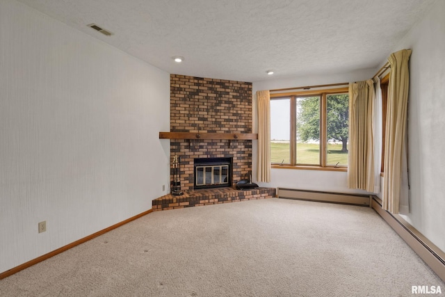 20425 20th Ave, Stockton, IA 52769 - unfurnished living room featuring carpet floors, a baseboard heating unit, a textured ceiling, a fireplace, and recessed lighting