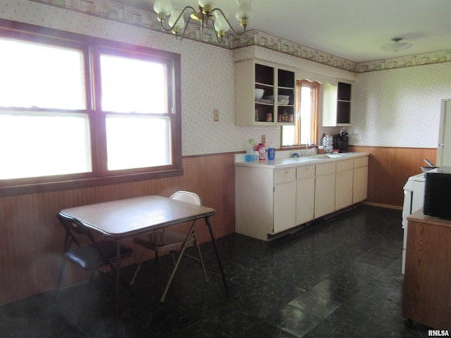 318 Meadowcrest Dr, Andover, IL 61233 - kitchen featuring a wainscoted wall, a chandelier, wallpapered walls, wooden walls, and open shelves