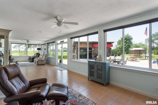 3473 270th St, De Witt, IA 52742 - sunroom with tile patterned floors, plenty of natural light, a textured ceiling, and french doors