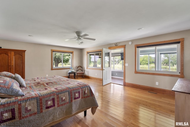 3473 270th St, De Witt, IA 52742 - bedroom featuring light wood finished floors, a ceiling fan, and recessed lighting