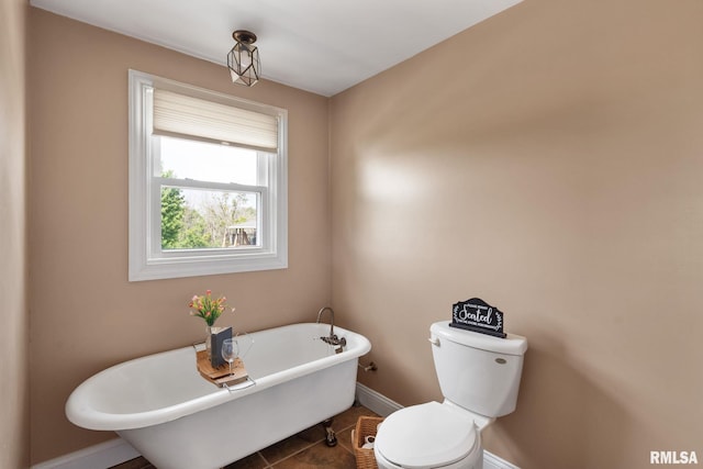 3473 270th St, De Witt, IA 52742 - bathroom featuring a soaking tub and tile patterned floors