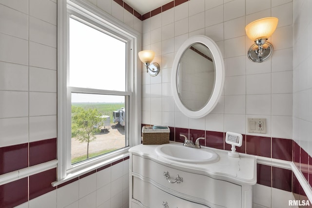3473 270th St, De Witt, IA 52742 - bathroom with tile walls, healthy amount of natural light, and vanity
