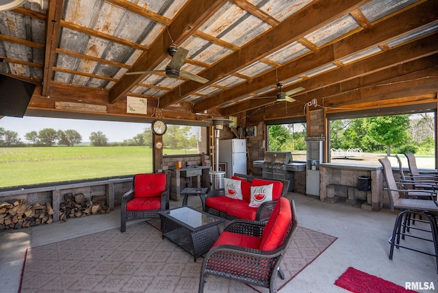 3473 270th St, De Witt, IA 52742 - view of patio / terrace featuring ceiling fan and exterior kitchen