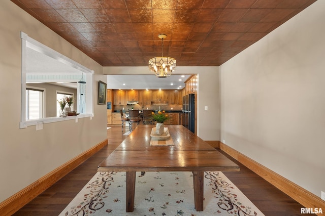 3473 270th St, De Witt, IA 52742 - dining area with a chandelier and dark wood finished floors