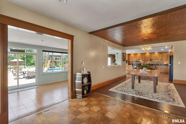 3473 270th St, De Witt, IA 52742 - dining space with a chandelier and parquet flooring