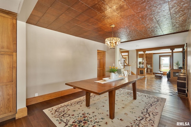 3473 270th St, De Witt, IA 52742 - dining space featuring dark wood finished floors, stairway, and a chandelier
