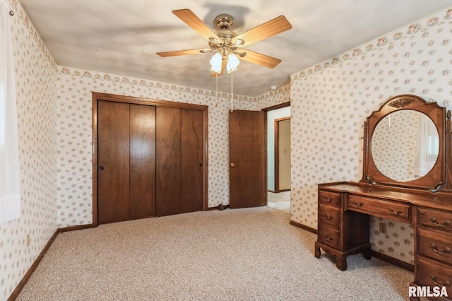 1031 15th Pl, Camanche, IA 52730 - bedroom with wallpapered walls, a closet, light colored carpet, and a ceiling fan
