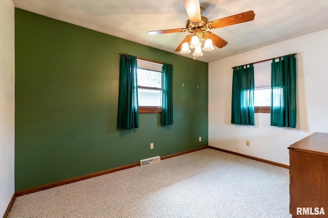 1031 15th Pl, Camanche, IA 52730 - unfurnished room with carpet floors and ceiling fan