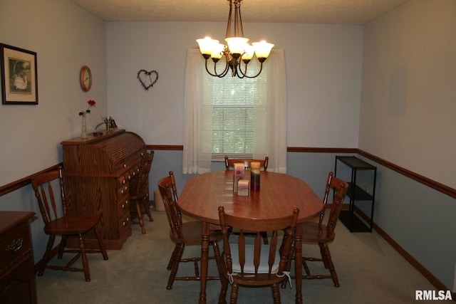 4145 Aspen Hills Dr, Bettendorf, IA 52722 - dining room featuring a chandelier and light carpet