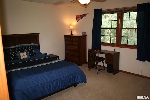 4145 Aspen Hills Dr, Bettendorf, IA 52722 - carpeted bedroom with a ceiling fan