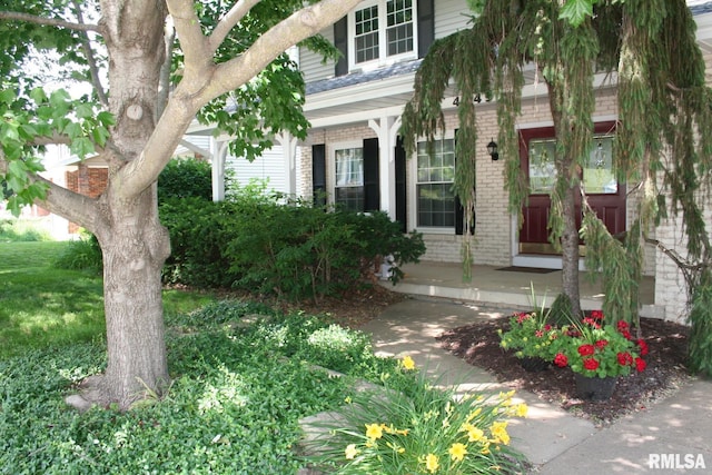 4145 Aspen Hills Dr, Bettendorf, IA 52722 - property entrance with brick siding and covered porch