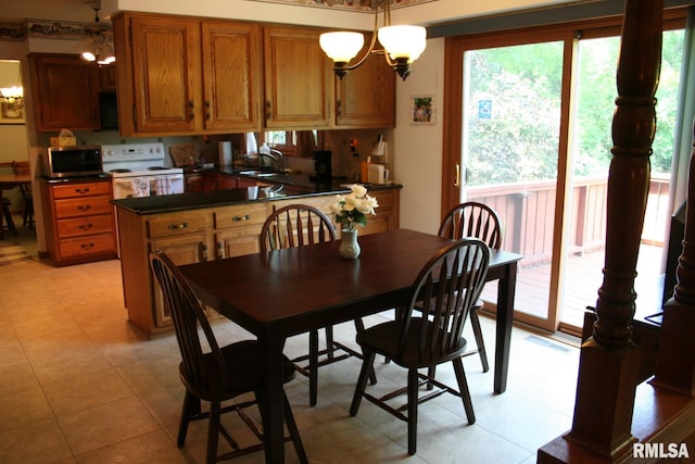 4145 Aspen Hills Dr, Bettendorf, IA 52722 - dining area with a chandelier
