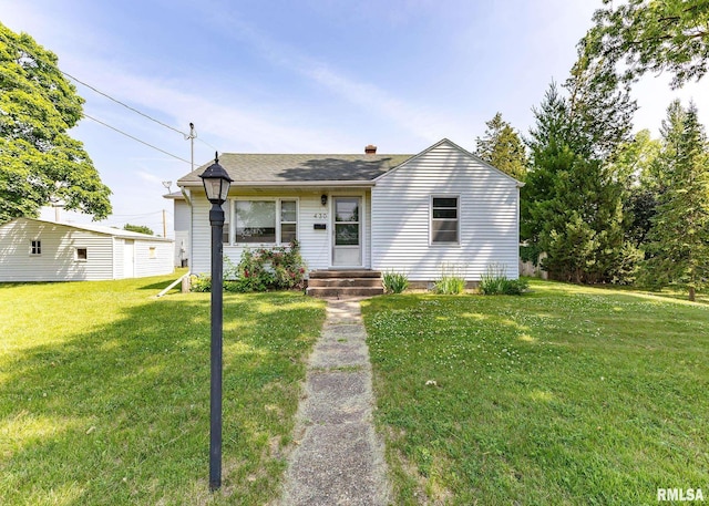 430 10th Pl, Camanche, IA 52730 - view of front of property with a front lawn