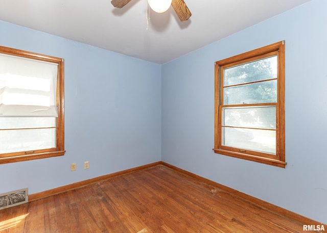 430 10th Pl, Camanche, IA 52730 - spare room featuring wood finished floors and a ceiling fan