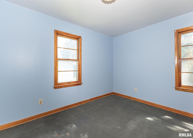 430 10th Pl, Camanche, IA 52730 - spare room with healthy amount of natural light and carpet floors