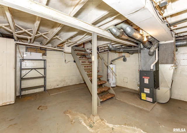 430 10th Pl, Camanche, IA 52730 - unfinished below grade area featuring water heater, heating unit, stairs, and concrete block wall