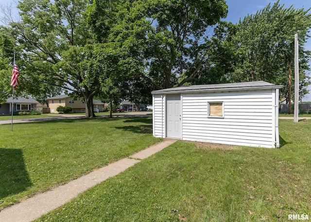 430 10th Pl, Camanche, IA 52730 - view of grassy yard featuring an outbuilding