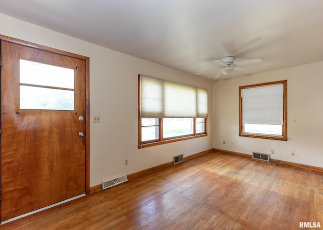430 10th Pl, Camanche, IA 52730 - unfurnished room featuring light wood finished floors and a ceiling fan