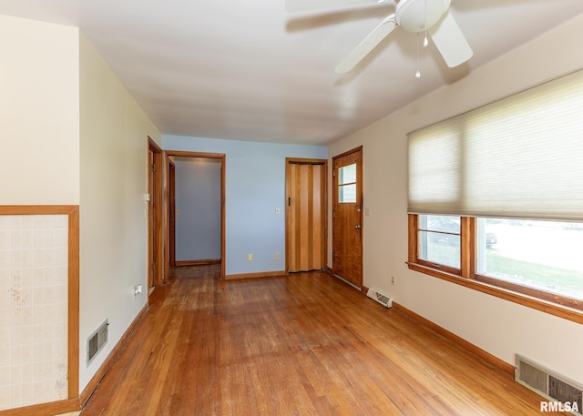 430 10th Pl, Camanche, IA 52730 - unfurnished room featuring wood finished floors and ceiling fan