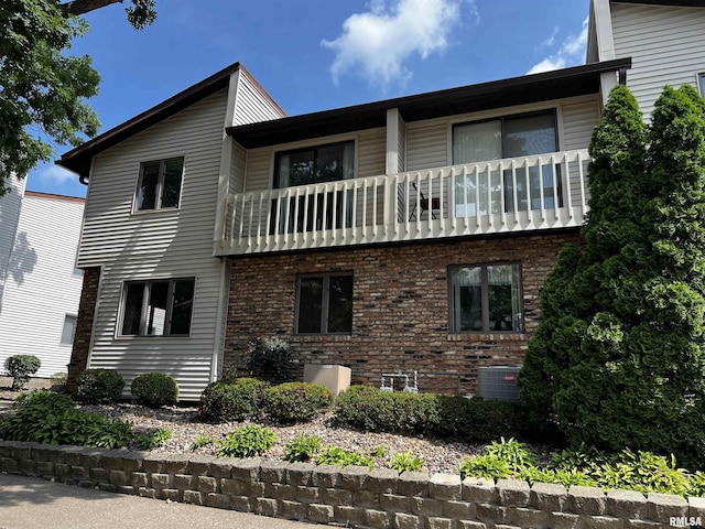 5903 36th Avenue Ct Unit 19, Moline, IL 61265 - view of front facade with a balcony and brick siding