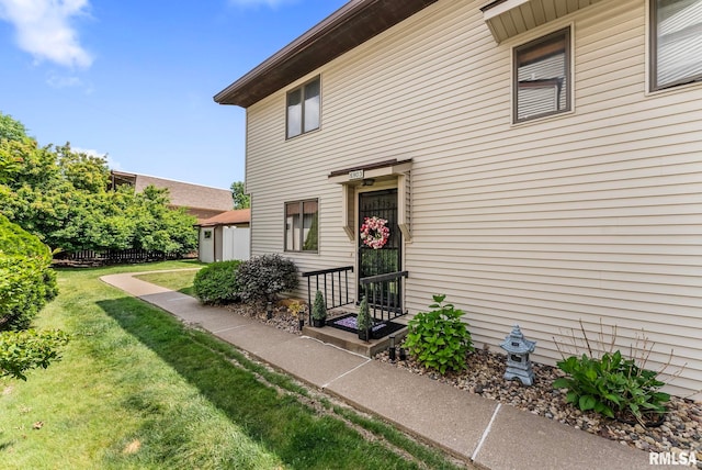 5903 36th Avenue Ct Unit 19, Moline, IL 61265 - doorway to property featuring a lawn