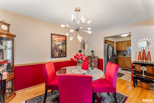 5903 36th Avenue Ct Unit 19, Moline, IL 61265 - dining room with a chandelier and light wood finished floors