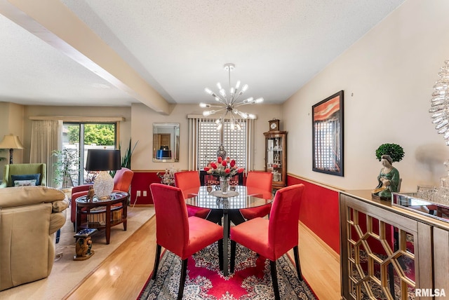 5903 36th Avenue Ct Unit 19, Moline, IL 61265 - dining space with wood finished floors, a chandelier, and beamed ceiling