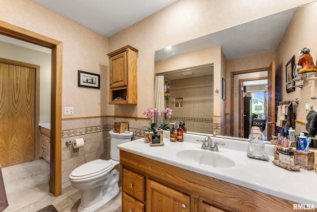5903 36th Avenue Ct Unit 19, Moline, IL 61265 - full bathroom with vanity, tile walls, tile patterned flooring, and a wainscoted wall