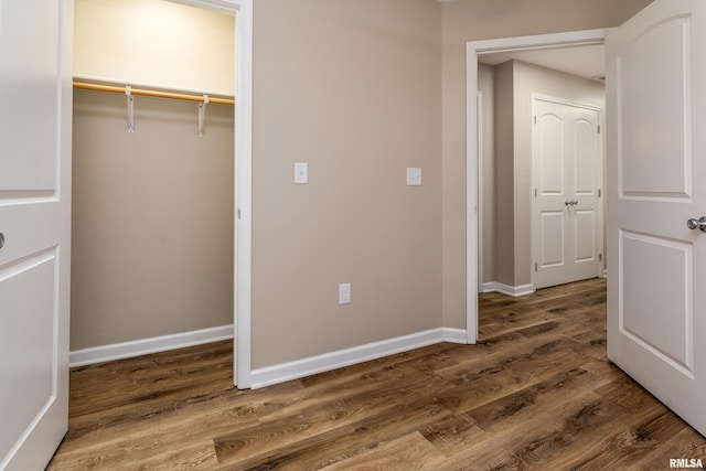 1321 N 7th St, Herrin, IL 62948 - unfurnished bedroom featuring wood finished floors and a closet