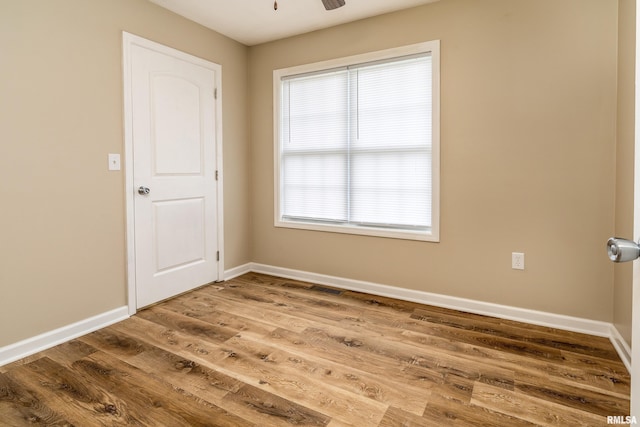 1321 N 7th St, Herrin, IL 62948 - unfurnished room with wood finished floors and ceiling fan