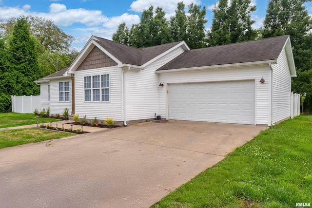 1321 N 7th St, Herrin, IL 62948 - ranch-style house with a garage, concrete driveway, and roof with shingles