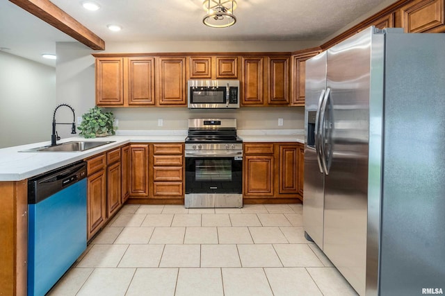 1321 N 7th St, Herrin, IL 62948 - kitchen with stainless steel appliances, brown cabinets, light countertops, and recessed lighting