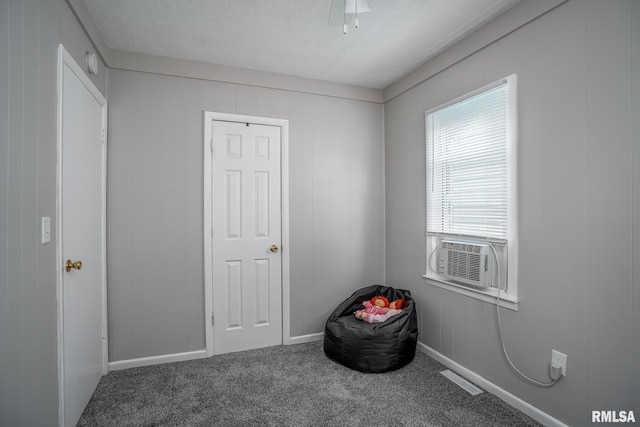3116 Orchard Ave, Davenport, IA 52802 - carpeted bedroom featuring cooling unit and a textured ceiling