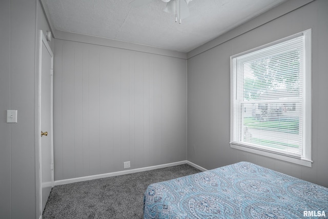 3116 Orchard Ave, Davenport, IA 52802 - carpeted bedroom featuring a textured ceiling and a ceiling fan