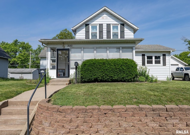 3020 Cleveland St, Clinton, IA 52732 - view of front of house featuring a front yard and a shingled roof