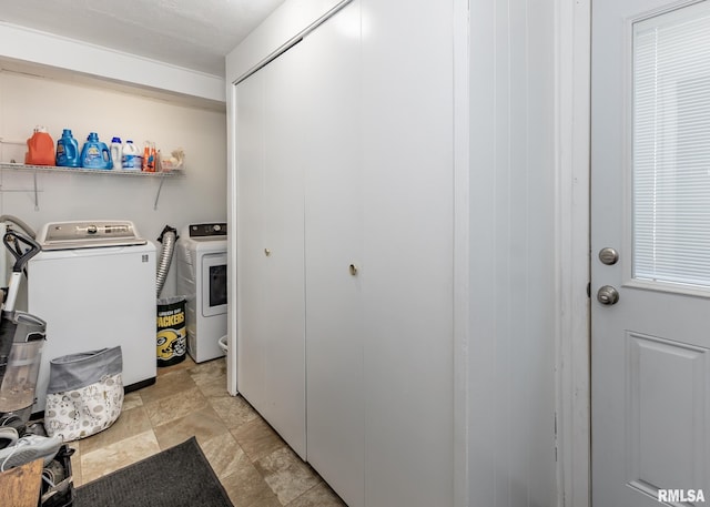 3020 Cleveland St, Clinton, IA 52732 - laundry room with washer and clothes dryer and stone finish flooring