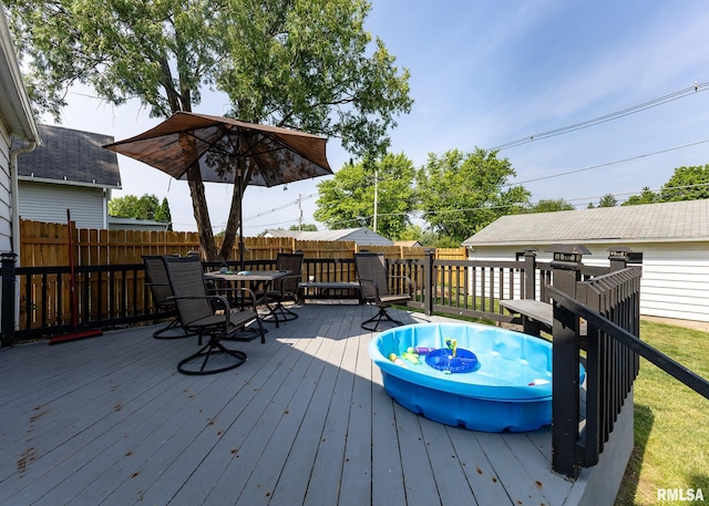 3020 Cleveland St, Clinton, IA 52732 - wooden deck featuring outdoor dining space