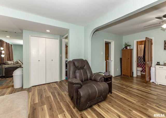3020 Cleveland St, Clinton, IA 52732 - living area with wood finished floors, arched walkways, ceiling fan, and recessed lighting