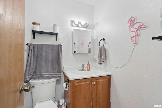 1426 W 48th St, Davenport, IA 52806 - bathroom featuring vanity and toilet