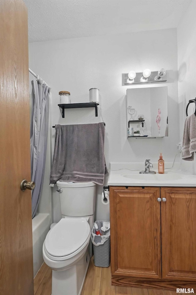 1426 W 48th St, Davenport, IA 52806 - full bathroom featuring vanity, wood finished floors, and shower / bath combo with shower curtain